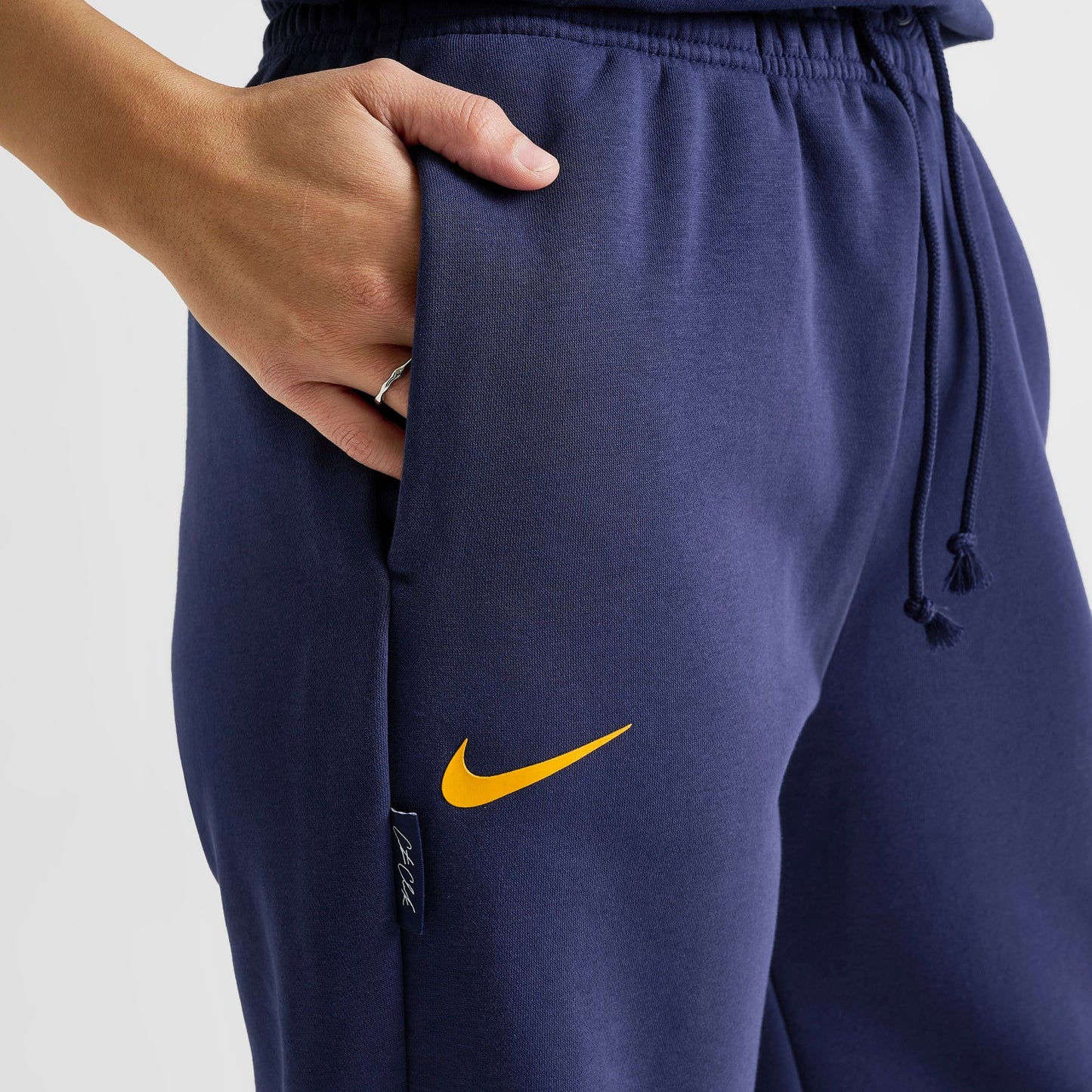 Women's Nike Caitlin Clark Essential Fleece Pants - Midnight Navy/Amarillo/Amarillo