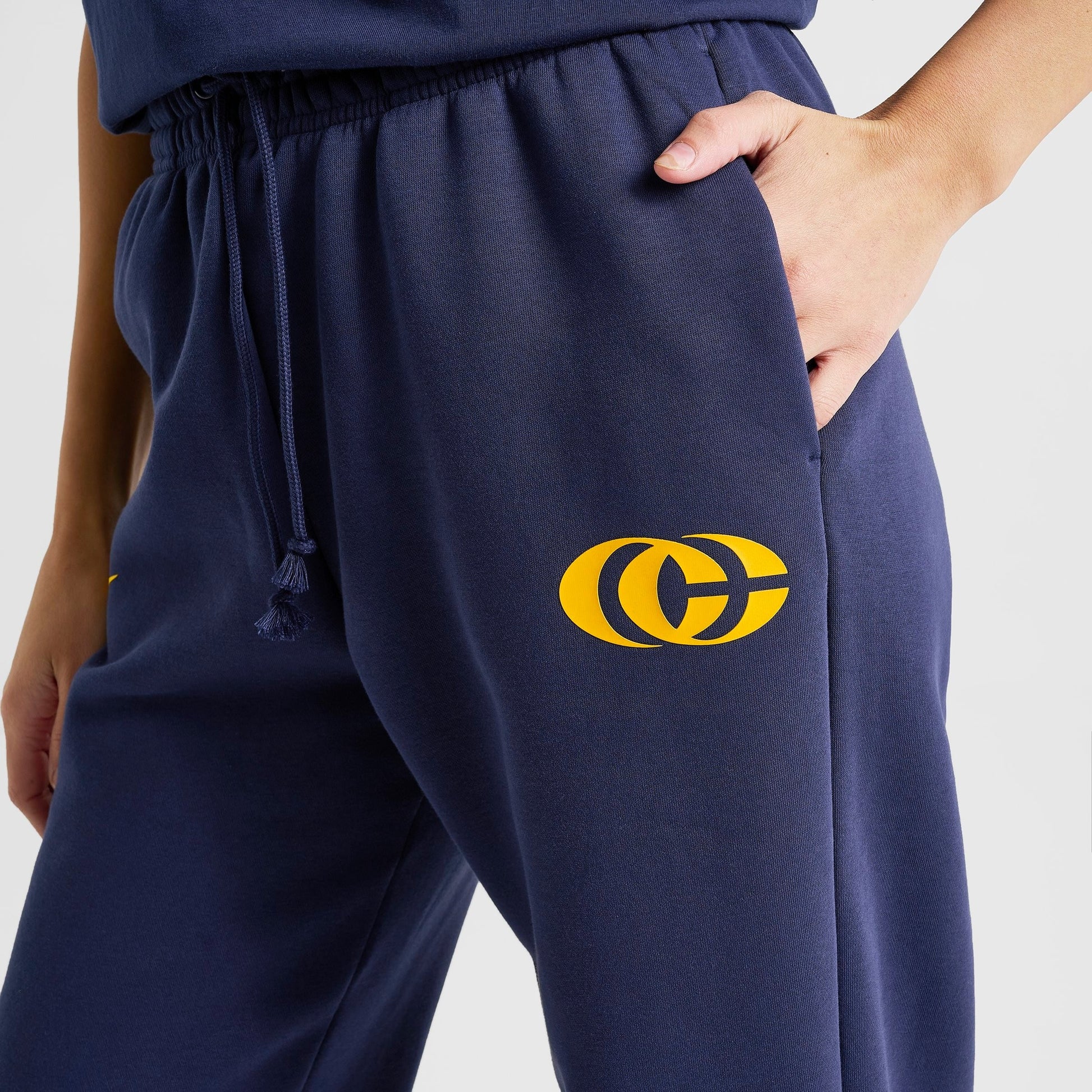 Women's Nike Caitlin Clark Essential Fleece Pants - Midnight Navy/Amarillo/Amarillo